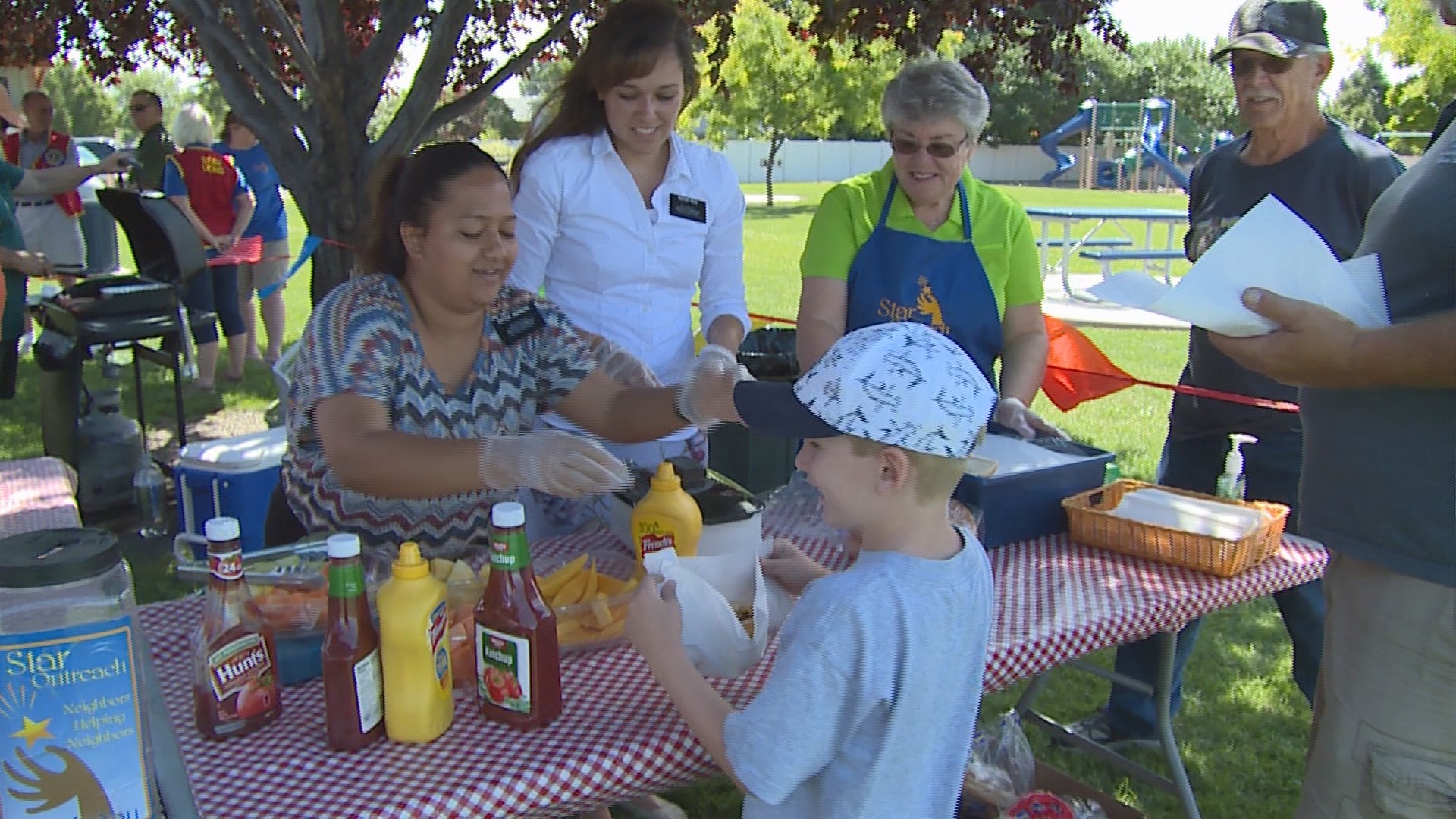Volunteers serving meals at community outreach